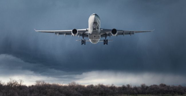 A large passenger jet flying high in the sky